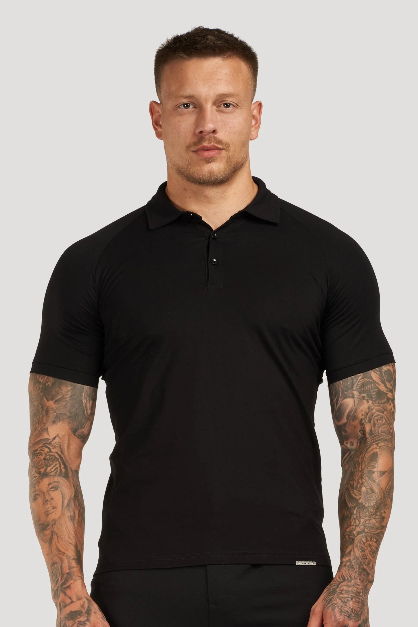 THE MUSCLE BUTTON POLO